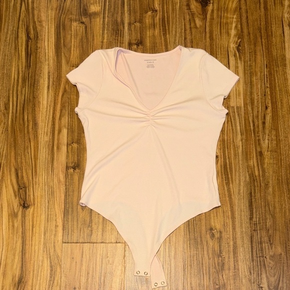 American Eagle Outfitters Tops - American Eagle Outfitters women’s XL bodysuit top vnevk cinch pink ribbed nwot